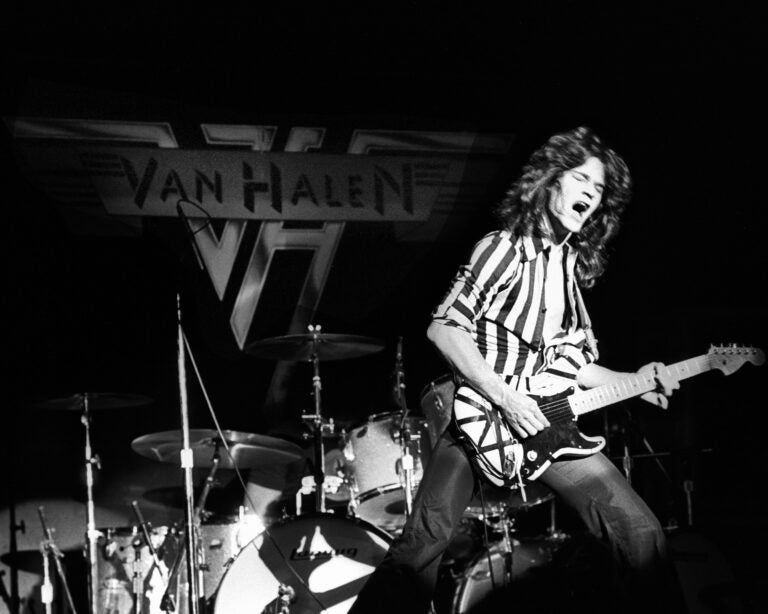 Eddie Van Halen playing the guitar on stage. Used (among others) for an article about Van Halen "Hot for Teacher"