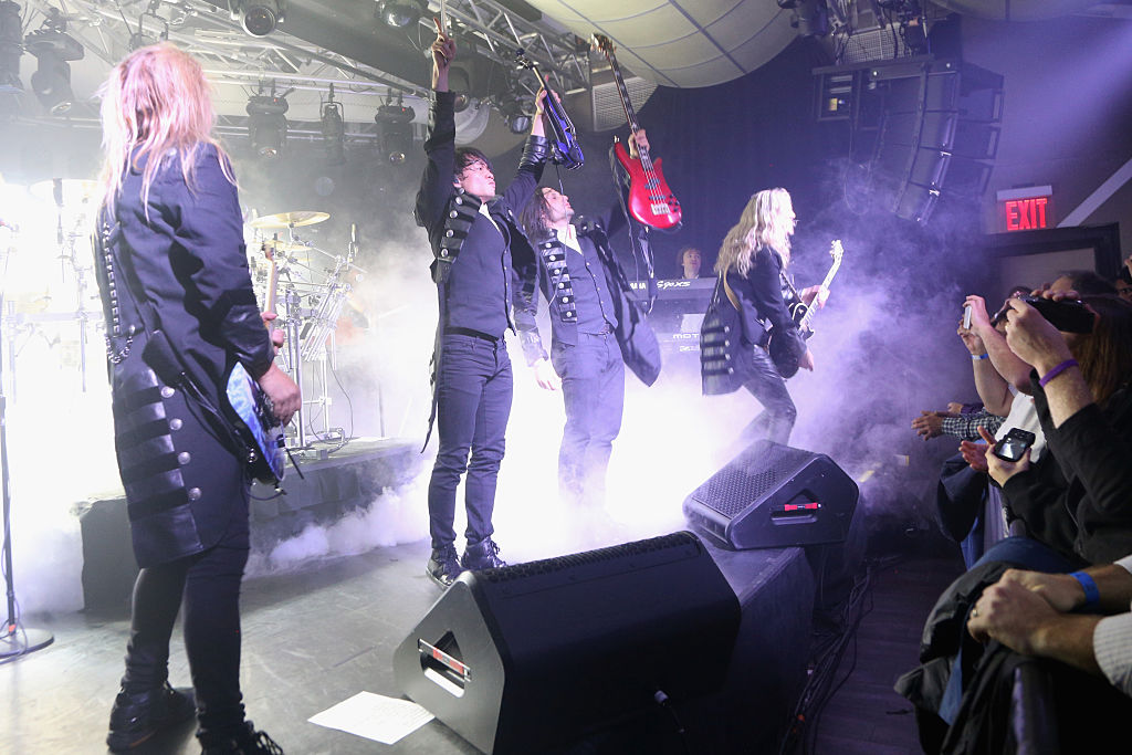 (L-R) Chris Caffery, Roddy Chong, David Z and Joel Hoekstra of Trans-Siberian Orchestra perform onstage Webber/Getty Images for iHeart Radio)