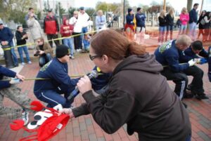 Doni yells at people playing tug-of-war