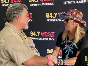 man shaking hands with Bret Michaels