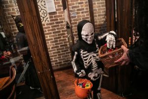 Skeleton costume trick or treating on Halloween