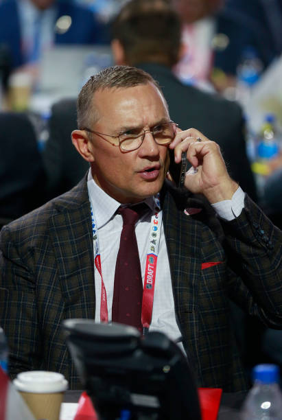 steve yzerman sit on the phone making sure he gets the draft pick he wants 