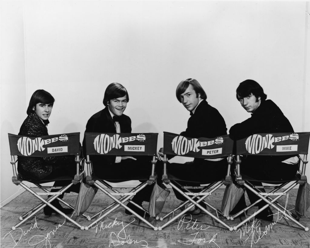 The Monkees Promo photo of all 4 Monkees sitting in Directors chairs