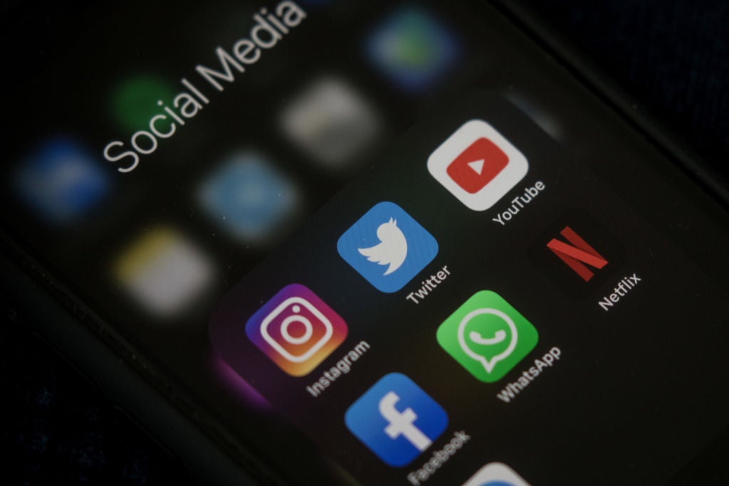 Social media apps on an iPhone. Man Suing Instagram, YouTube, And TikTok For Being 'Too Addicting' also used on an article about best practices on spam texts