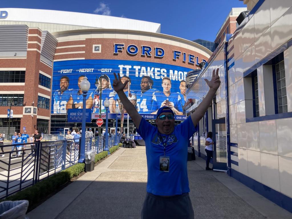 man celebrates lions victory